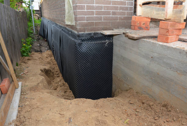 SJ Waterproofing Pros technician performing targeted Interior Drainage System assessment in Denville, NJ